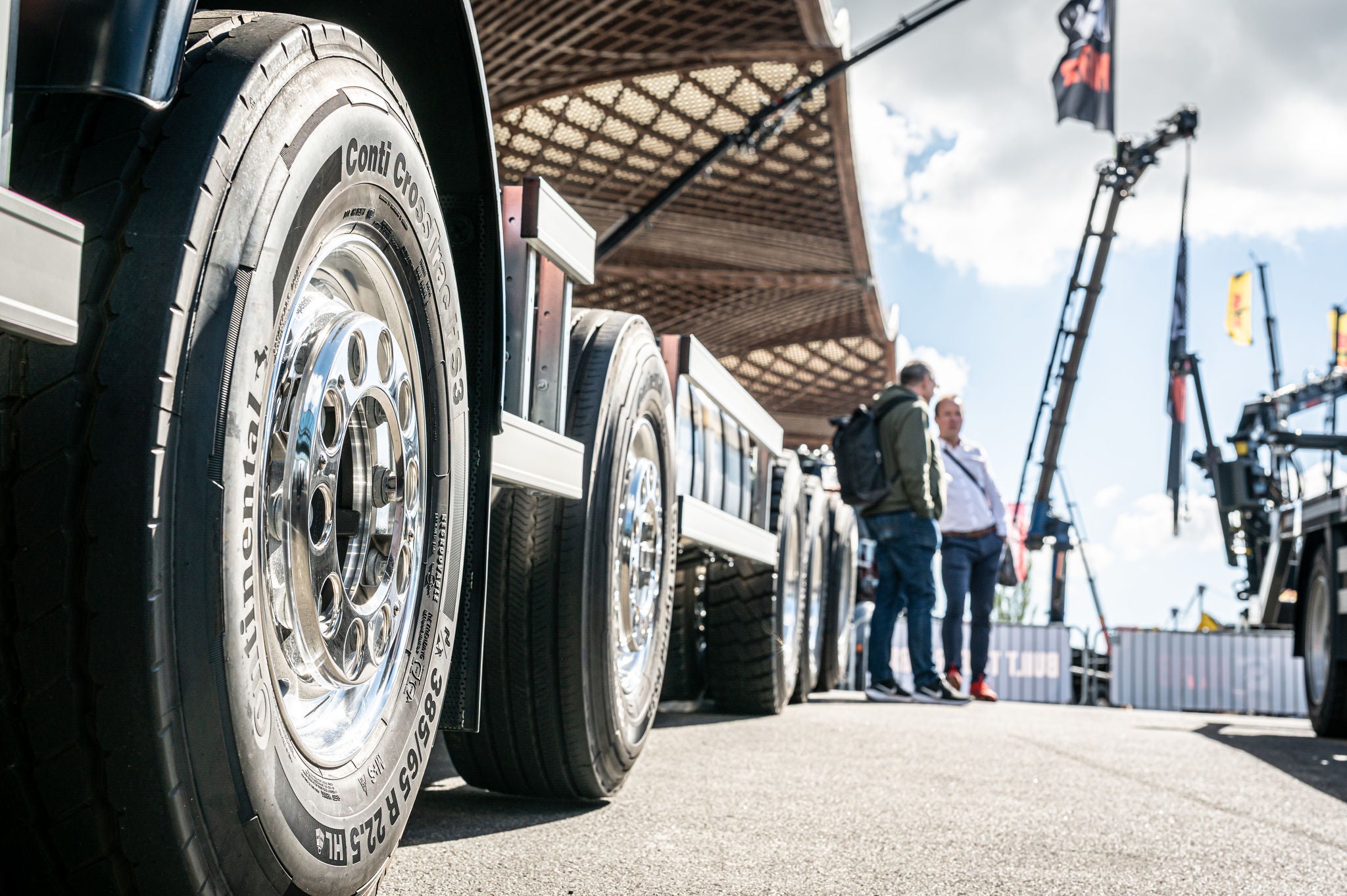 A close-up of a truck tire mounted on a truck 