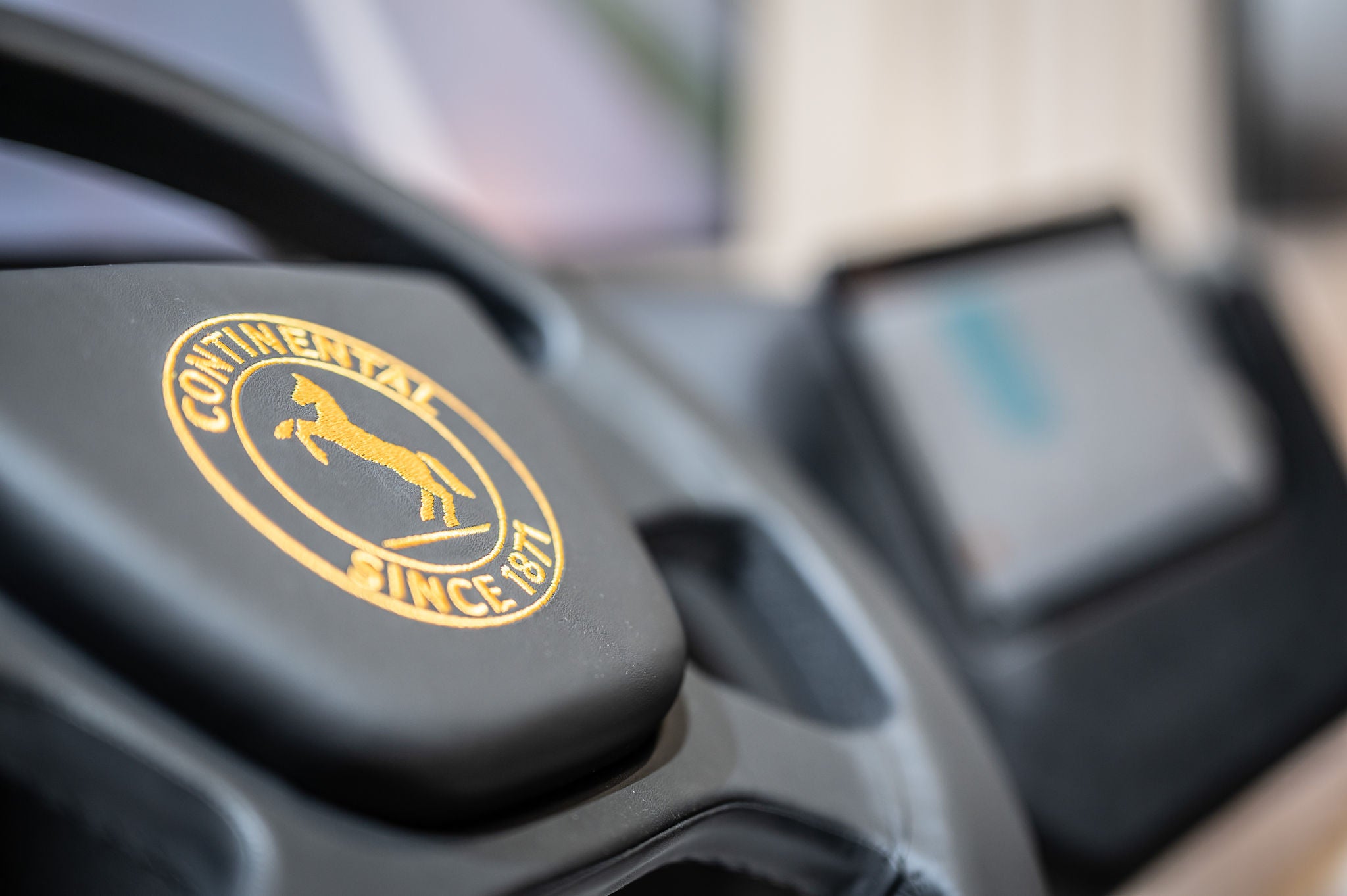 A close up of a steering wheel